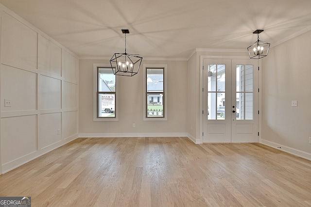 375 Werner Way, Senoia, GA 30276 - entrance foyer with a chandelier, light wood-style floors, ornamental molding, and french doors