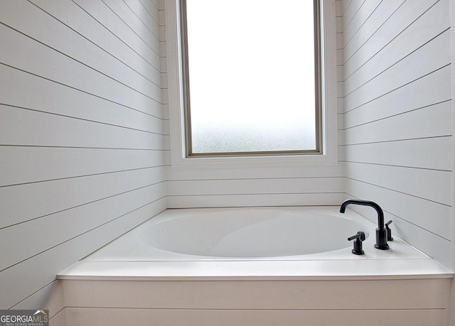 375 Werner Way, Senoia, GA 30276 - bathroom featuring a bath and wood walls
