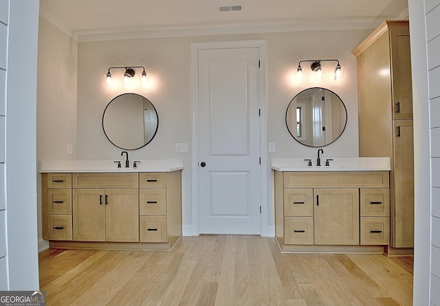 375 Werner Way, Senoia, GA 30276 - full bath with wood finished floors, two vanities, and ornamental molding