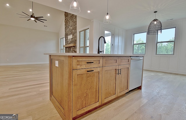 375 Werner Way, Senoia, GA 30276 - kitchen with dishwasher, light wood-type flooring, open floor plan, lofted ceiling, and an island with sink