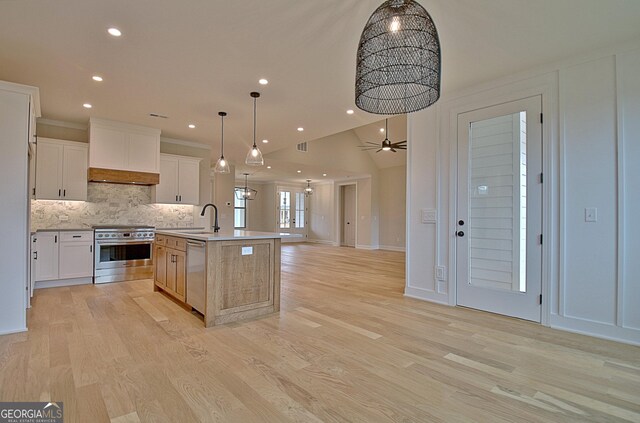 375 Werner Way, Senoia, GA 30276 - kitchen featuring stainless steel appliances, open floor plan, recessed lighting, backsplash, and light countertops