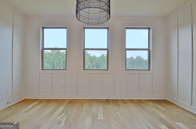 375 Werner Way, Senoia, GA 30276 - empty room with light wood-style floors and a decorative wall