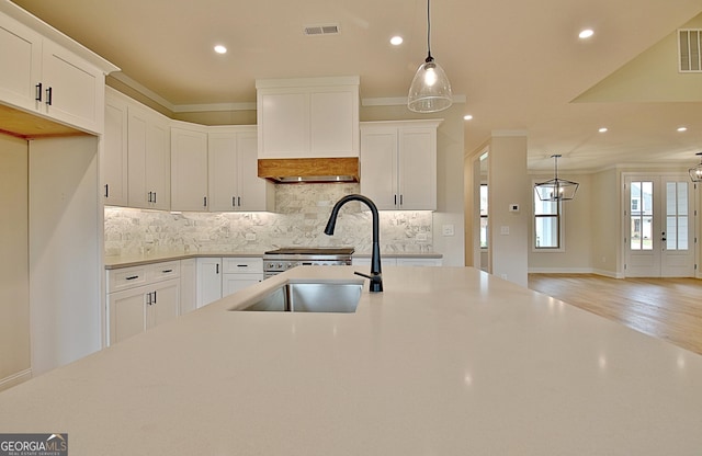 375 Werner Way, Senoia, GA 30276 - kitchen featuring recessed lighting, backsplash, light countertops, white cabinetry, and decorative light fixtures