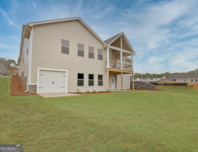 375 Werner Way, Senoia, GA 30276 - back of house featuring a balcony, a yard, ceiling fan, and a garage