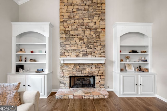 1205 Compass Pointe Xing, Alpharetta, GA 30005 - living area with wood finished floors, a fireplace, and crown molding