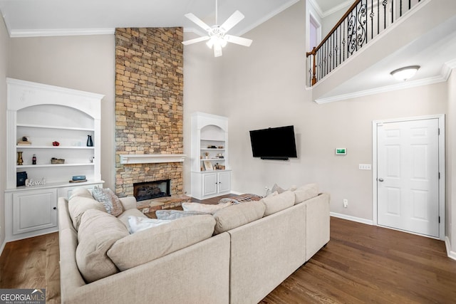 1205 Compass Pointe Xing, Alpharetta, GA 30005 - living room featuring a ceiling fan, dark wood-style floors, high vaulted ceiling, a stone fireplace, and baseboards