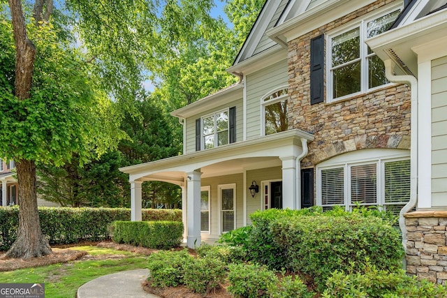 1205 Compass Pointe Xing, Alpharetta, GA 30005 - entrance to property with stone siding and a porch