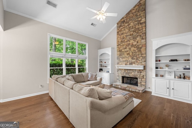 1205 Compass Pointe Xing, Alpharetta, GA 30005 - living area with a ceiling fan, wood finished floors, high vaulted ceiling, a stone fireplace, and crown molding