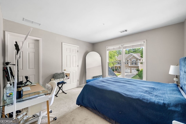 1205 Compass Pointe Xing, Alpharetta, GA 30005 - bedroom with light carpet and access to exterior