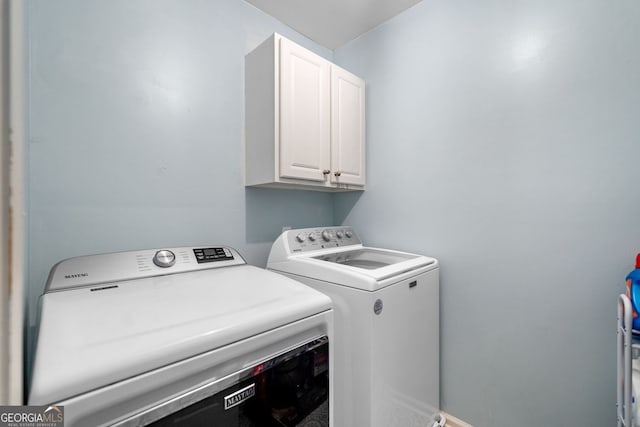 1205 Compass Pointe Xing, Alpharetta, GA 30005 - laundry room featuring cabinet space and independent washer and dryer