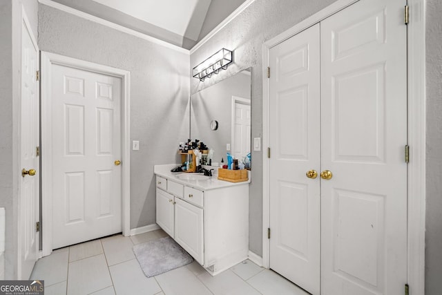 1205 Compass Pointe Xing, Alpharetta, GA 30005 - bathroom with vanity, tile patterned flooring, a textured wall, and baseboards