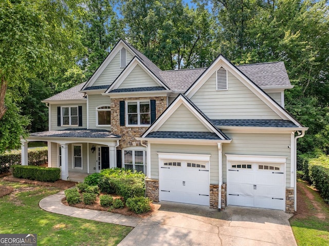 1205 Compass Pointe Xing, Alpharetta, GA 30005 - view of front of house with concrete driveway, roof with shingles, a garage, stone siding, and covered porch