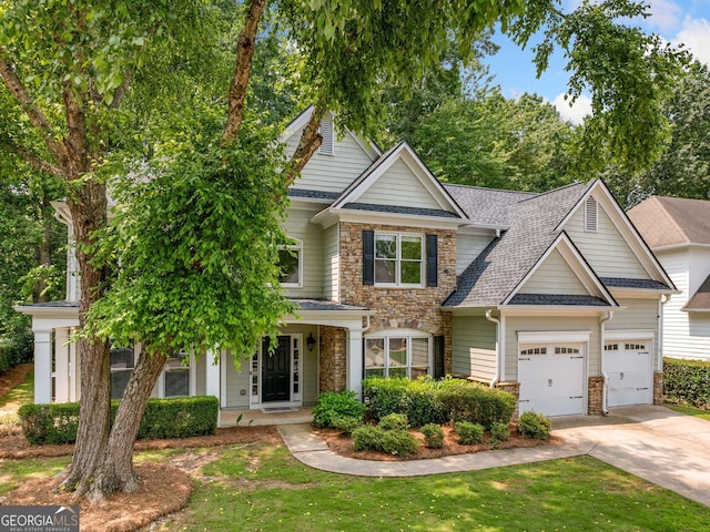 1205 Compass Pointe Xing, Alpharetta, GA 30005 - view of front facade featuring stone siding, concrete driveway, an attached garage, roof with shingles, and a front yard