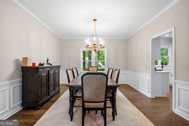 1205 Compass Pointe Xing, Alpharetta, GA 30005 - dining room featuring healthy amount of natural light, a chandelier, ornamental molding, a decorative wall, and dark wood-style floors