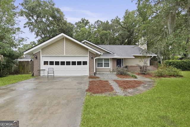 9 Red Fox Ct, Savannah, GA 31419 - view of front of property featuring brick siding, a chimney, an attached garage, and concrete driveway
