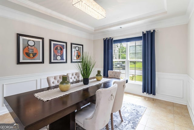 441 Spring View Dr, Woodstock, GA 30188 - dining space with a raised ceiling, ornamental molding, wainscoting, light tile patterned flooring, and a decorative wall