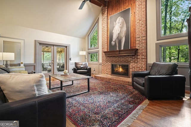 11940 Mountain Laurel Dr, Roswell, GA 30075 - living area featuring high vaulted ceiling, wood finished floors, a fireplace, healthy amount of natural light, and a ceiling fan