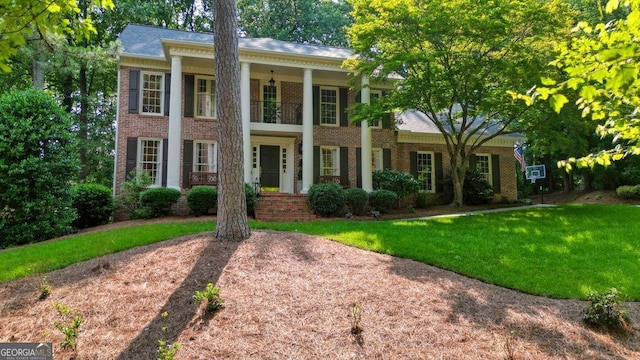 11940 Mountain Laurel Dr, Roswell, GA 30075 - neoclassical / greek revival house featuring brick siding and a front lawn