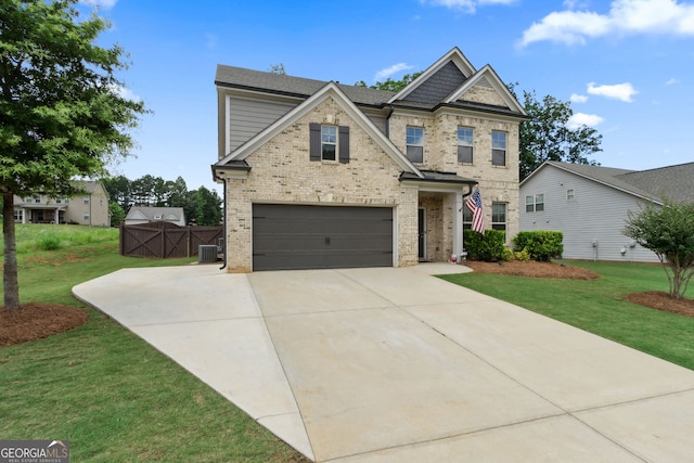 836 Hawkins Creek Dr, Jefferson, GA 30549 - view of front facade featuring brick siding, a front lawn, concrete driveway, and an attached garage