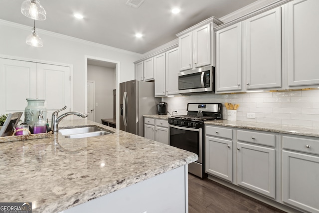 836 Hawkins Creek Dr, Jefferson, GA 30549 - kitchen with appliances with stainless steel finishes, ornamental molding, tasteful backsplash, hanging light fixtures, and dark wood finished floors