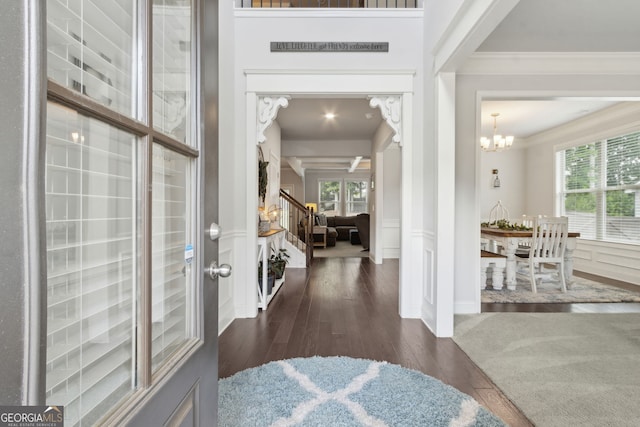 836 Hawkins Creek Dr, Jefferson, GA 30549 - foyer entrance with crown molding, plenty of natural light, dark wood-type flooring, and a chandelier