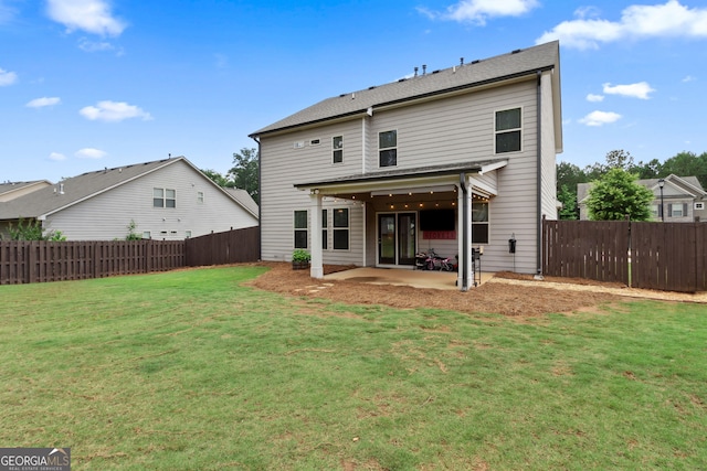 836 Hawkins Creek Dr, Jefferson, GA 30549 - back of property with a patio area and a fenced backyard