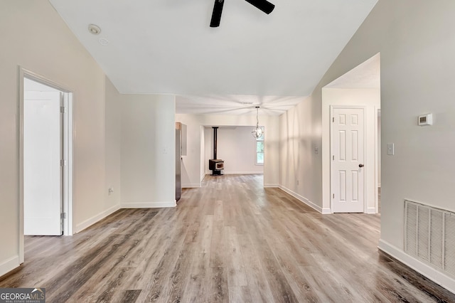 85 Prestigious Pl, Senoia, GA 30276 - unfurnished living room with vaulted ceiling, ceiling fan, light wood finished floors, and baseboards