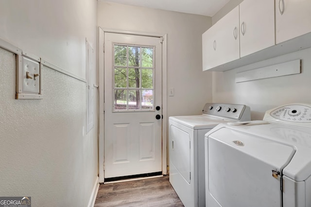 85 Prestigious Pl, Senoia, GA 30276 - laundry room with cabinet space, washer and dryer, wood finished floors, and baseboards