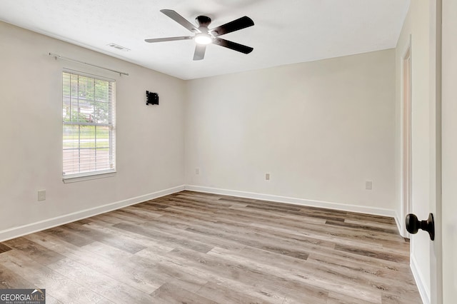 85 Prestigious Pl, Senoia, GA 30276 - empty room featuring light wood-style floors, a ceiling fan, and baseboards
