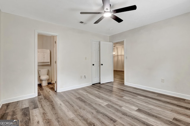 85 Prestigious Pl, Senoia, GA 30276 - unfurnished bedroom featuring wood finished floors, baseboards, connected bathroom, and a closet