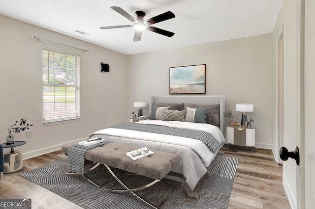 85 Prestigious Pl, Senoia, GA 30276 - bedroom with wood finished floors, baseboards, and ceiling fan