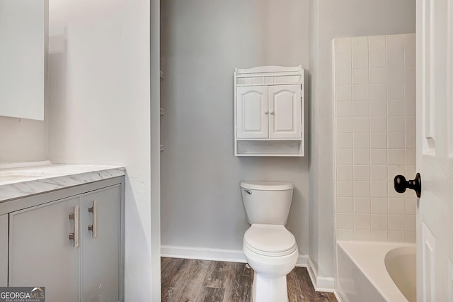 85 Prestigious Pl, Senoia, GA 30276 - full bathroom with vanity, toilet, wood finished floors, and baseboards