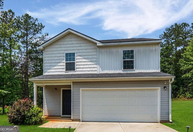 20 Sloane Ct Unit 64, Covington, GA 30016 - view of front of house featuring driveway, a front yard, an attached garage, and covered porch