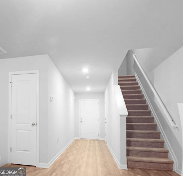 20 Sloane Ct Unit 64, Covington, GA 30016 - entrance foyer with light wood-type flooring, stairs, and baseboards