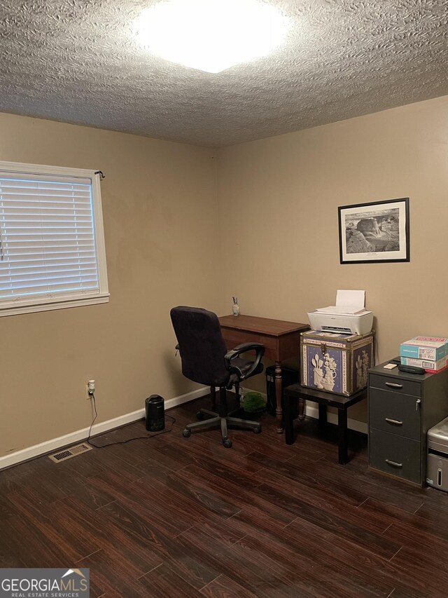 501 Lakeshore Dr, Monticello, GA 31064 - office space featuring dark wood-type flooring, a textured ceiling, and baseboards