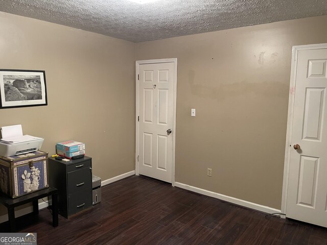 501 Lakeshore Dr, Monticello, GA 31064 - office space with dark wood-style flooring, a textured ceiling, and baseboards