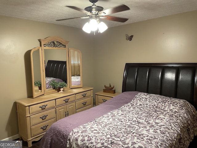 501 Lakeshore Dr, Monticello, GA 31064 - bedroom featuring a textured ceiling and ceiling fan
