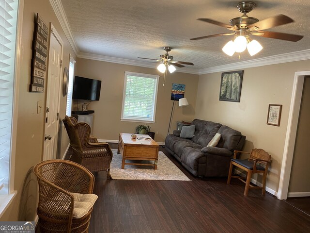 501 Lakeshore Dr, Monticello, GA 31064 - living area featuring dark wood-type flooring, ceiling fan, baseboards, crown molding, and a textured ceiling