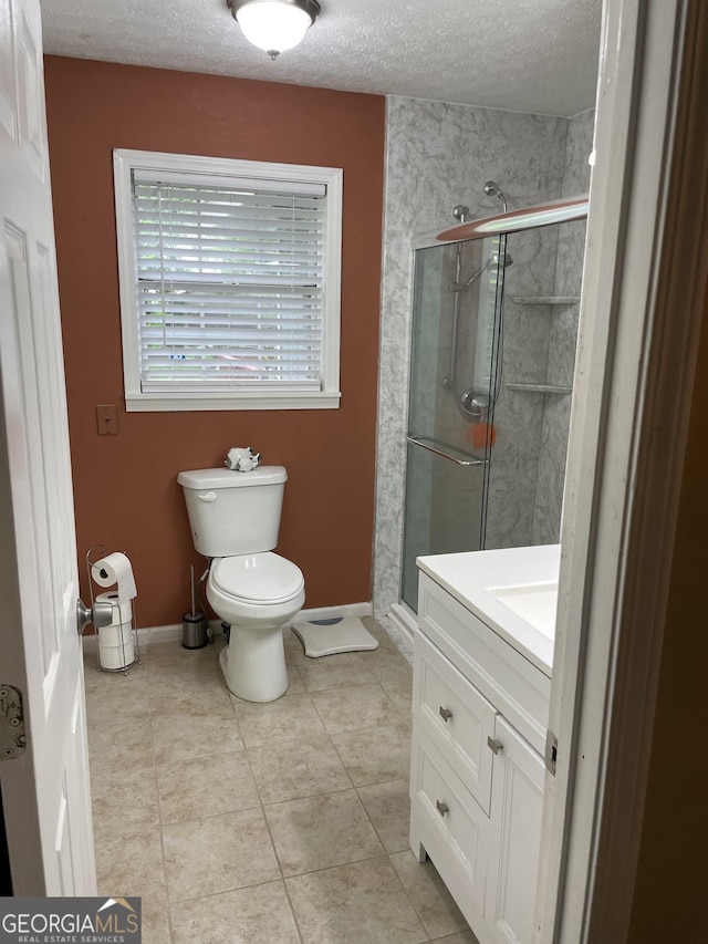 501 Lakeshore Dr, Monticello, GA 31064 - bathroom with a textured ceiling, toilet, a stall shower, baseboards, and vanity