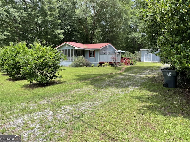 501 Lakeshore Dr, Monticello, GA 31064 - view of green lawn with a sunroom