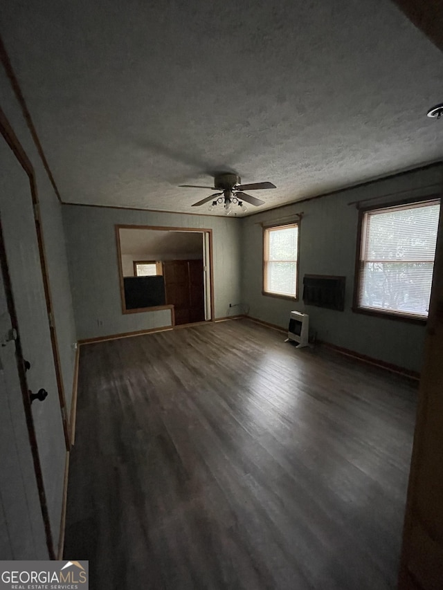 1095 Mountain Shadows Dr, Cleveland, GA 30528 - unfurnished living room with wood finished floors, a textured ceiling, a ceiling fan, and baseboards