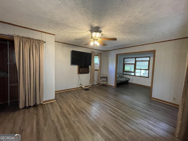 1095 Mountain Shadows Dr, Cleveland, GA 30528 - unfurnished living room featuring baseboards, wood finished floors, a ceiling fan, a textured ceiling, and crown molding