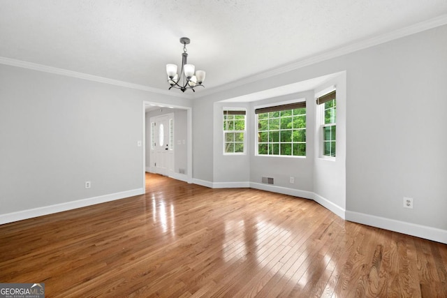 4197 Chadds Xing, Marietta, GA 30062 - unfurnished room featuring a chandelier, ornamental molding, baseboards, and wood finished floors