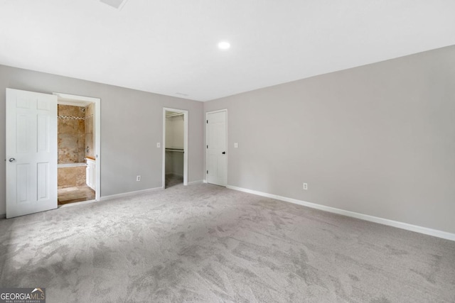 4197 Chadds Xing, Marietta, GA 30062 - unfurnished bedroom featuring baseboards, carpet flooring, a walk in closet, connected bathroom, and recessed lighting