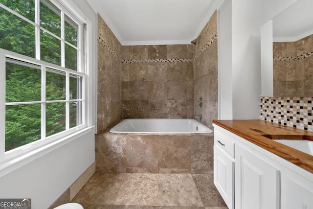 4197 Chadds Xing, Marietta, GA 30062 - bathroom featuring a tub with marble appearance, vanity, ornamental molding, tasteful backsplash, and a shower