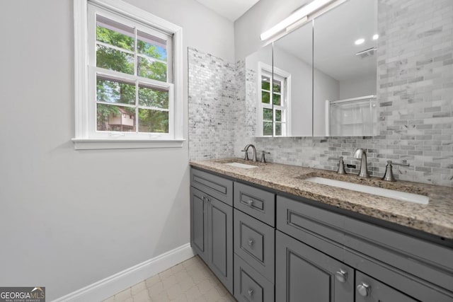 4197 Chadds Xing, Marietta, GA 30062 - full bath featuring baseboards, decorative backsplash, double vanity, and tile patterned flooring