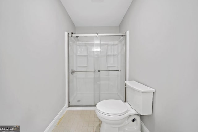 4197 Chadds Xing, Marietta, GA 30062 - full bath with a shower stall, toilet, baseboards, and tile patterned floors