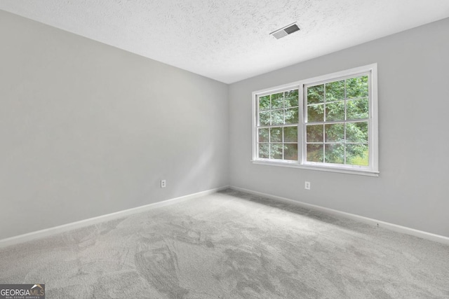 4197 Chadds Xing, Marietta, GA 30062 - carpeted spare room with baseboards and a textured ceiling