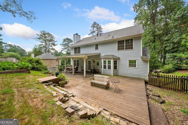 4197 Chadds Xing, Marietta, GA 30062 - back of property with a wooden deck, a chimney, roof with shingles, and outdoor dining space