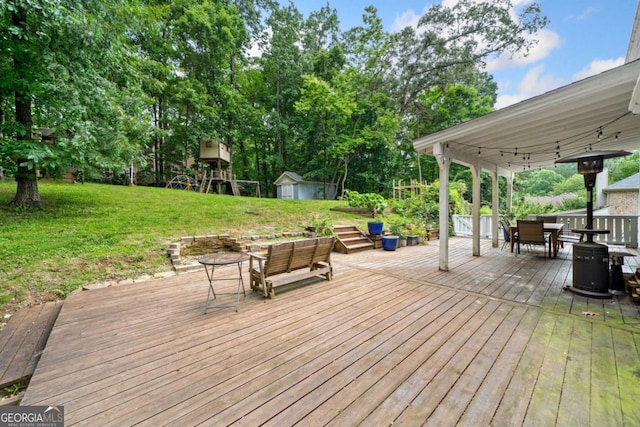 4197 Chadds Xing, Marietta, GA 30062 - wooden deck with outdoor dining area and a yard